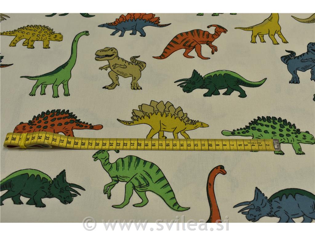 Dekorativno blago - različni barvni dinozavri na smetana osnovi