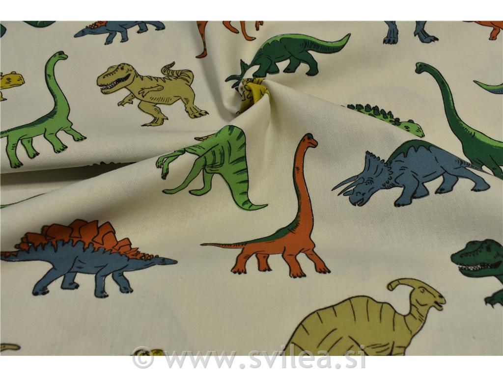 Dekorativno blago - različni barvni dinozavri na smetana osnovi